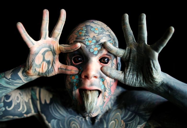 Sylvain, alias Freaky Hoody, a primary school teacher and France's "most tattooed man", poses with his eyes full of black ink at Palaiseau, southern Paris, France, September 25, 2020. REUTERS/Charles Platiau
